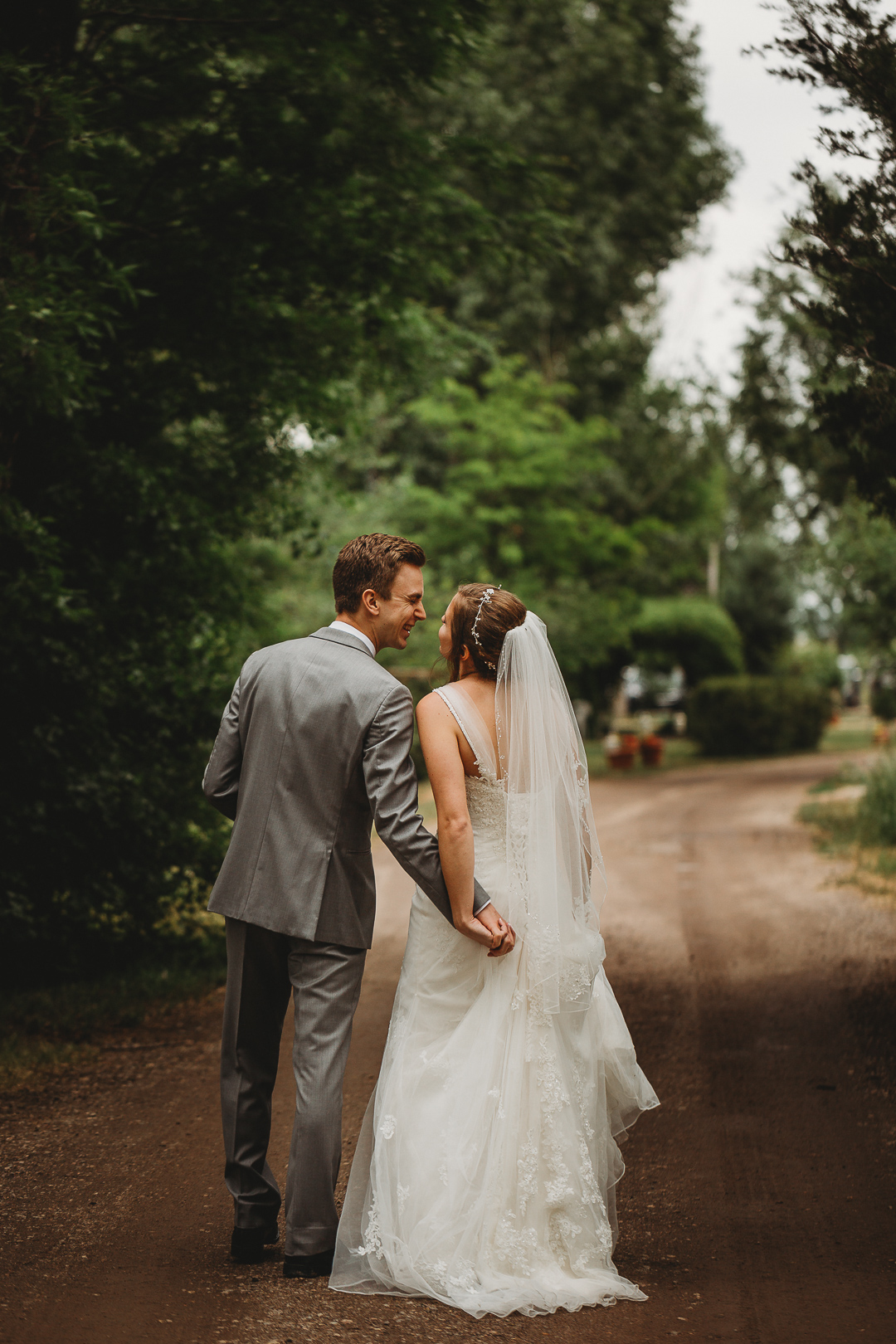 bride and groom embrace at lone hawk farm
