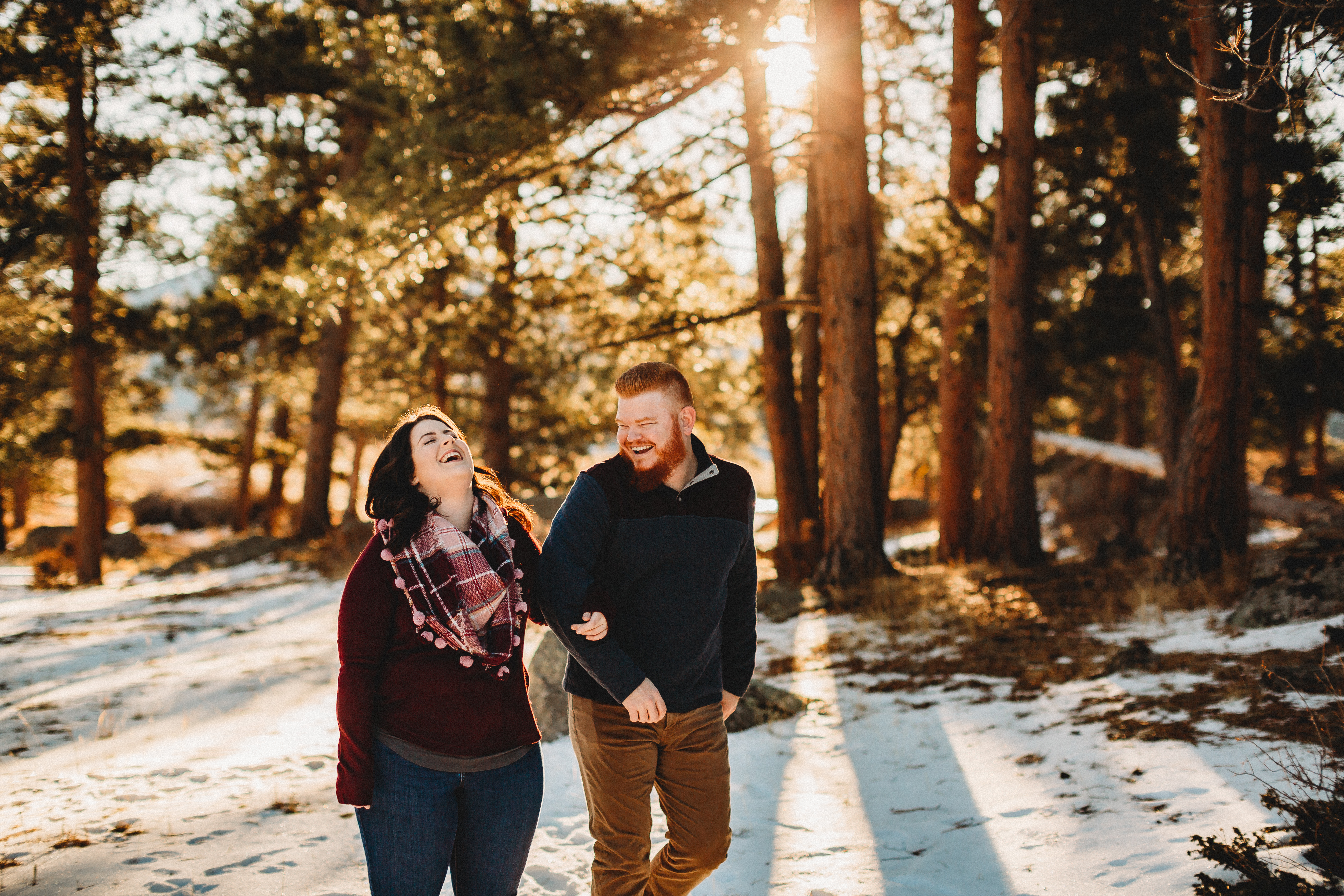couple laughs in RMNP in the winter