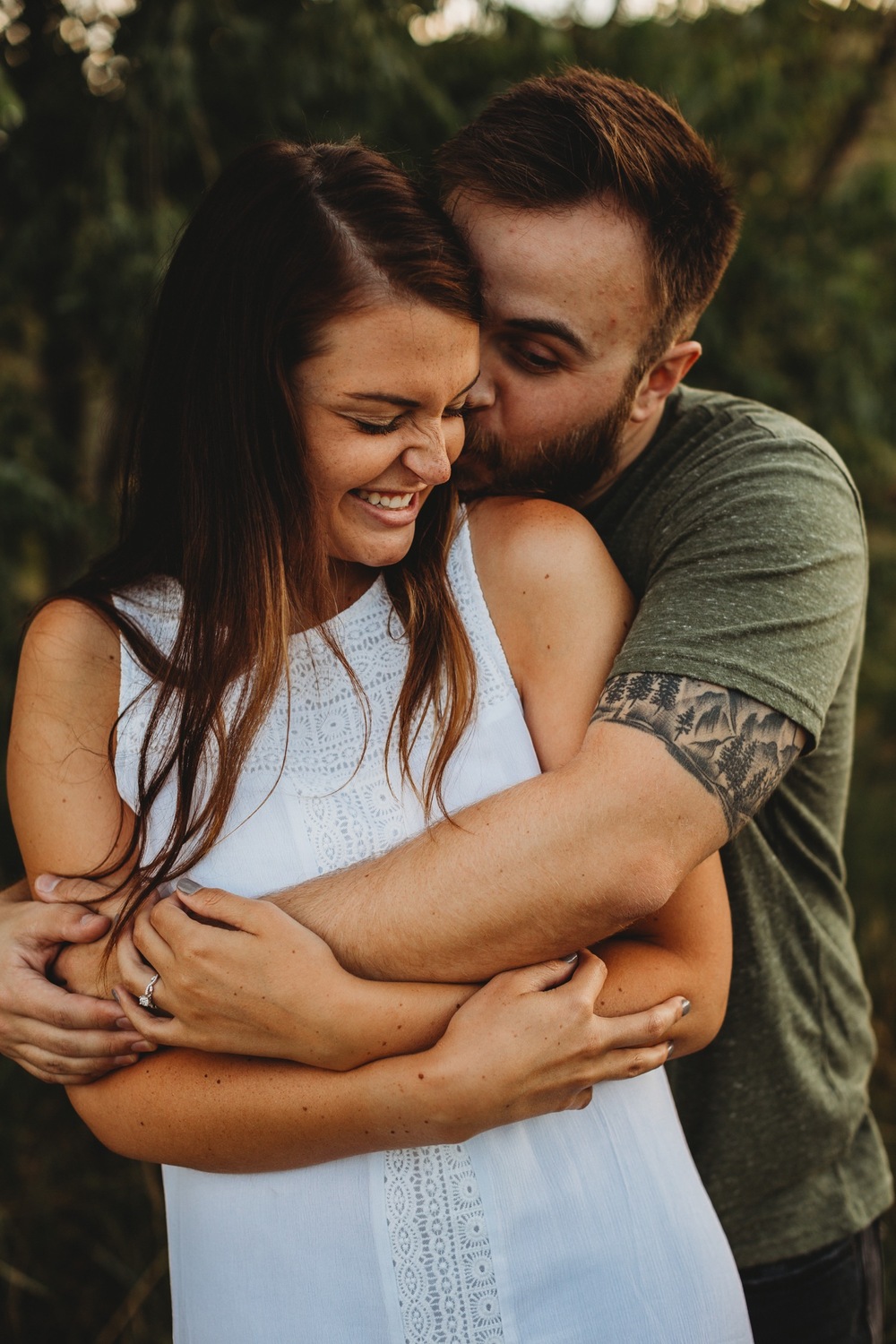 Close up of engaged couple smiling together at sunrise in Longmont