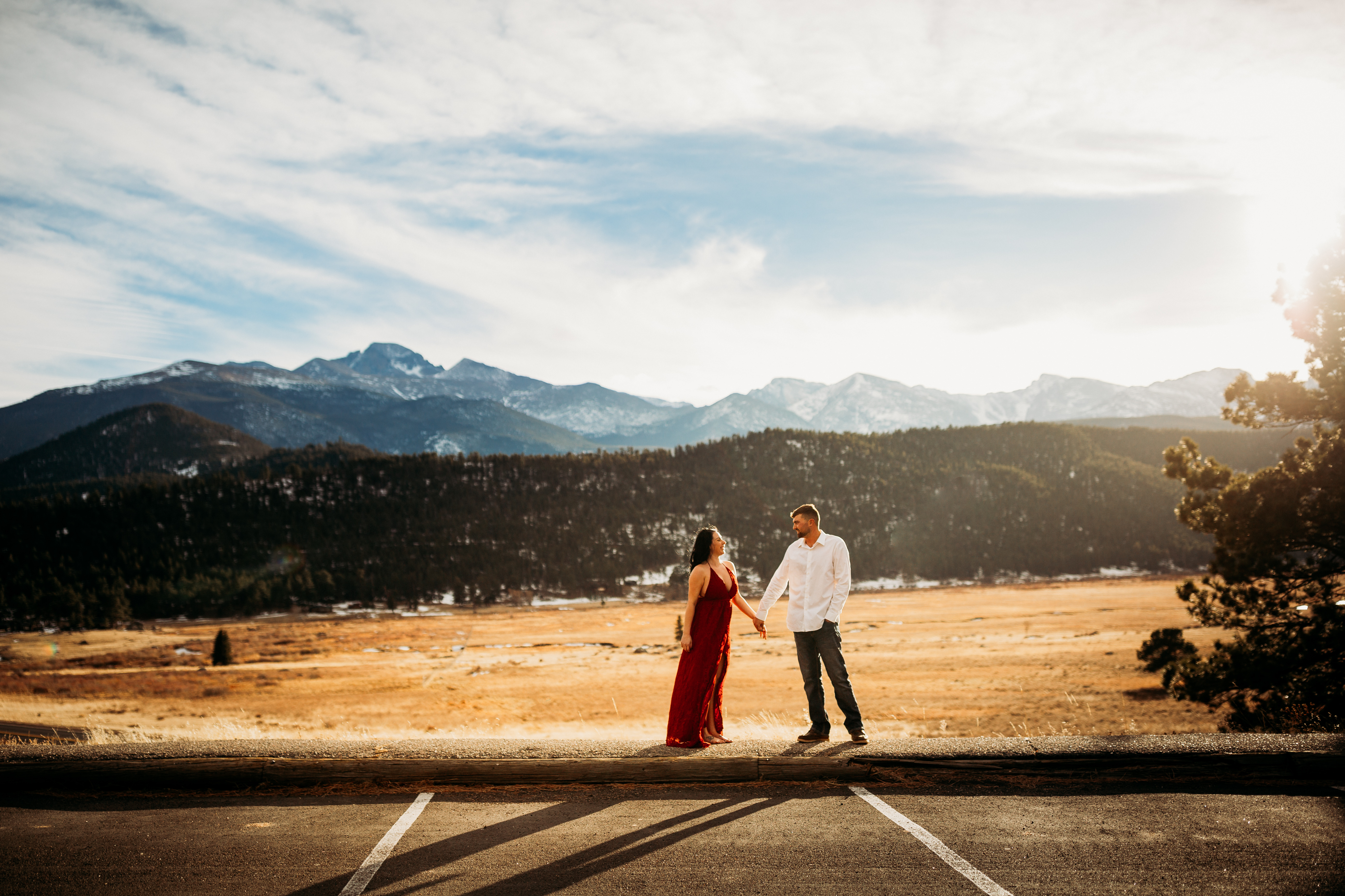engaged couple holds hands in Rocky Mountain national park