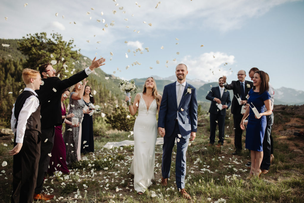 Bride and group celebrate their elopement in Estes Park, Colorado with family and friends.