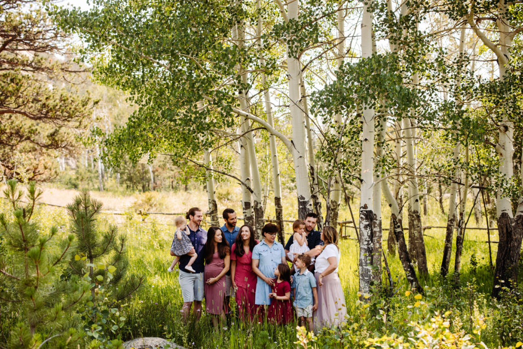 An extended family takes photos at Lumpy Ridge in Estes Park